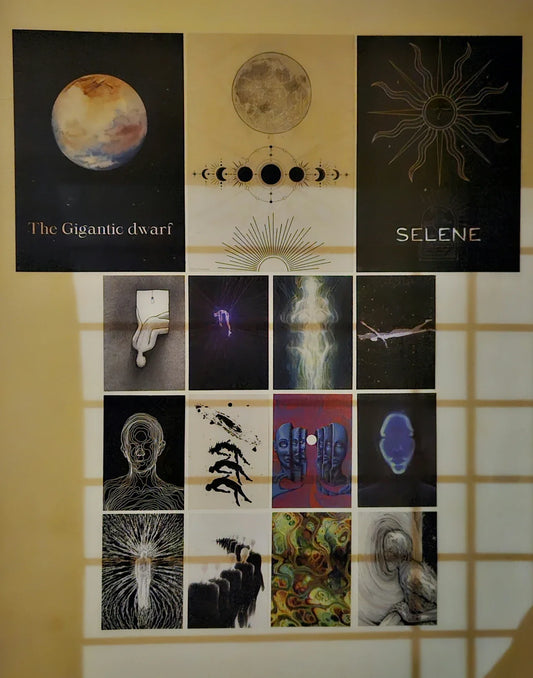 cosmic room decor - gallery wall collage of celestial and astronomy art prints on a sunlit bedroom wall