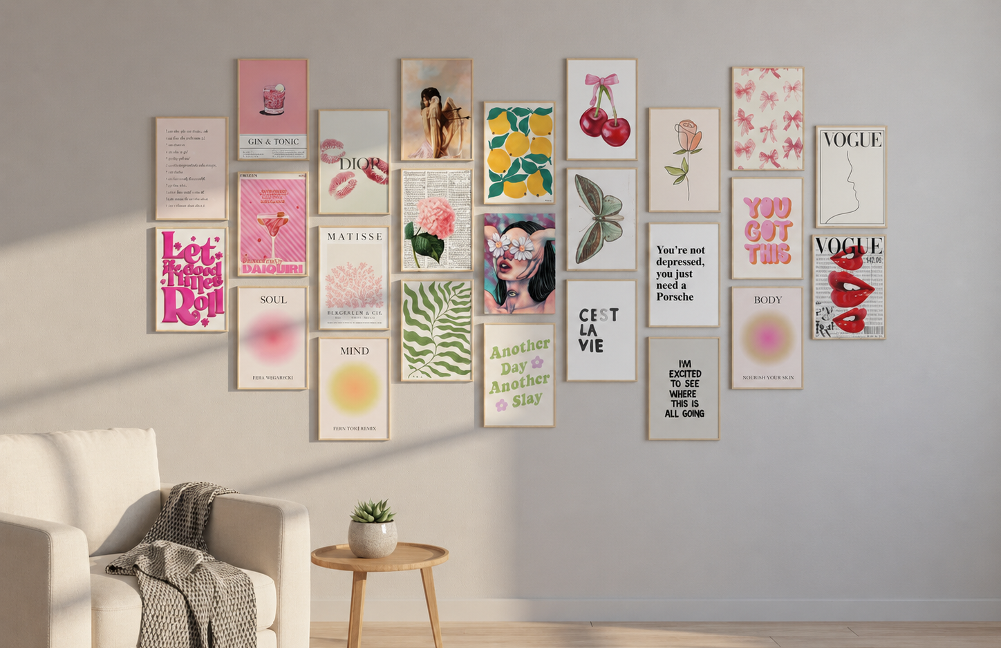 Wall collage kits displayed in a cozy neutral living room with framed pink, botanical and typography art prints.