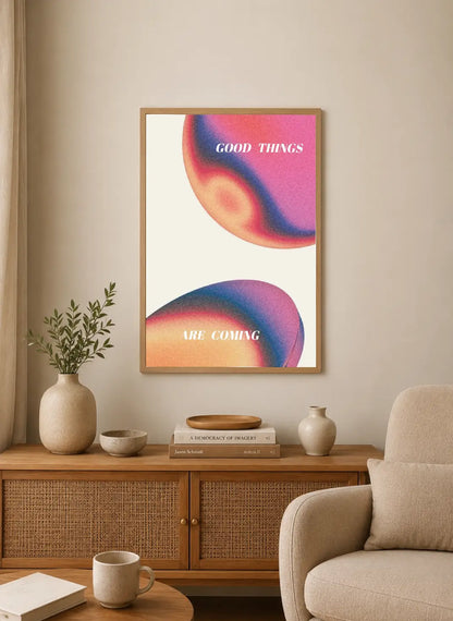 Portrait poster with abstract gradient forms in pink, orange, and blue, overlaid with white sans-serif text reading "GOOD THINGS ARE COMING"