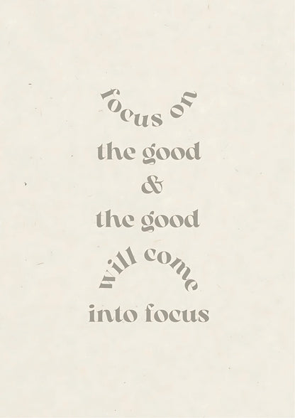 Text in muted grey on off-white background reads: "focus on the good & the good will come into focus" with curved lines above and below phrases