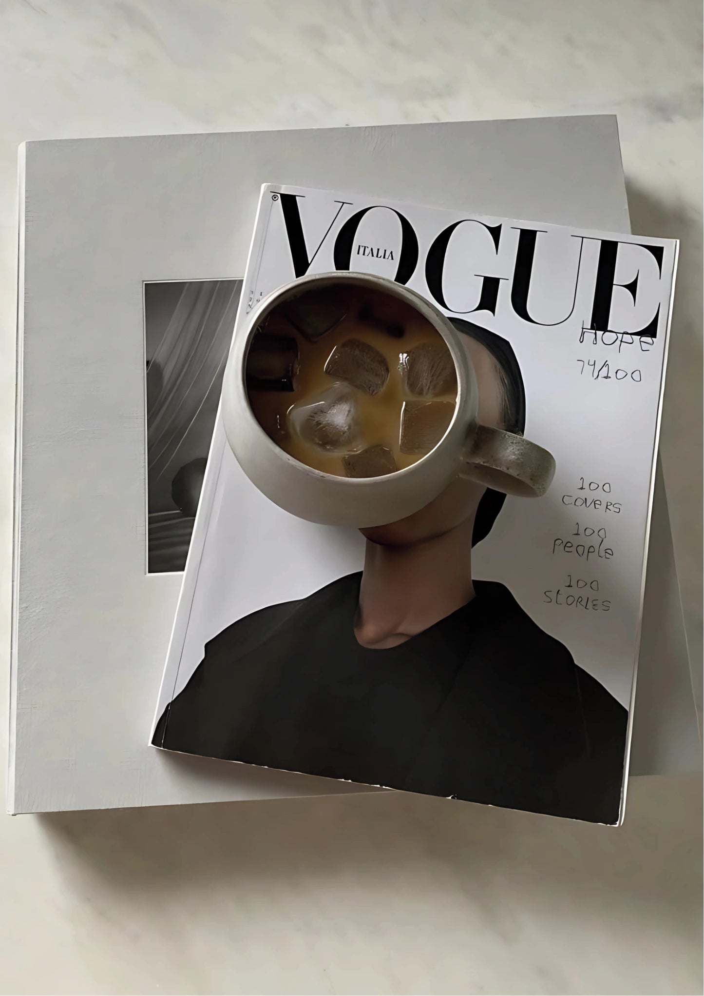 White background with bold black "VOGUE ITALIA" title, handwritten text "HOPE 74/100", and "100 COVERS 100 PEOPLE 100 STORIES"