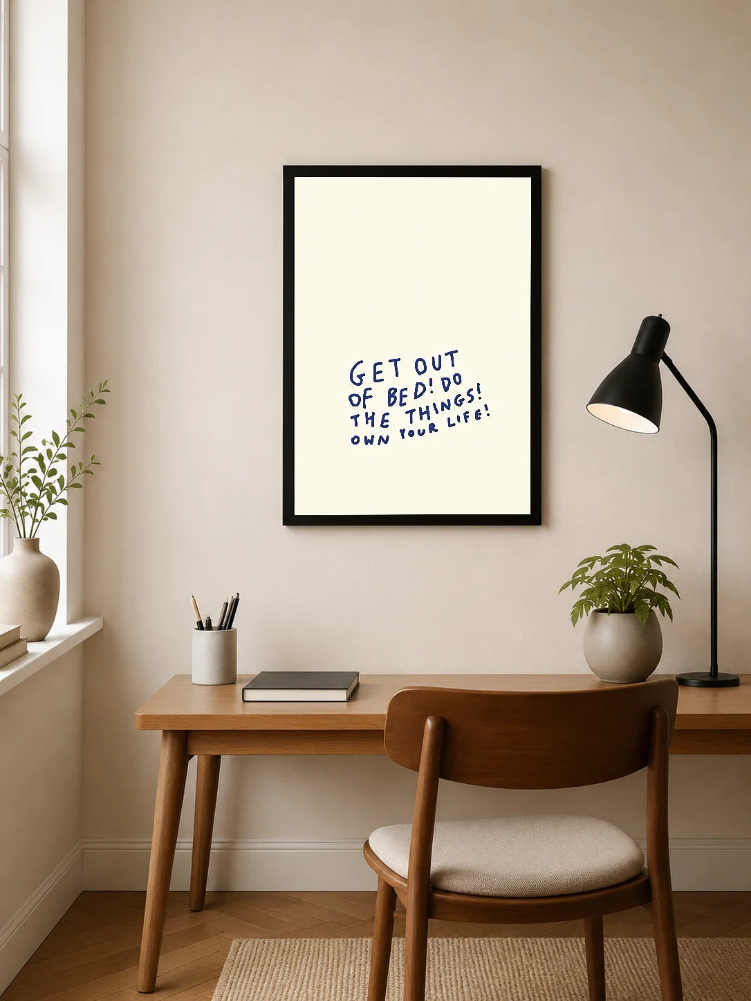 Portrait poster with hand-lettered text in navy blue on cream background: "GET OUT OF BED! DO THE THINGS! OWN YOUR LIFE!"