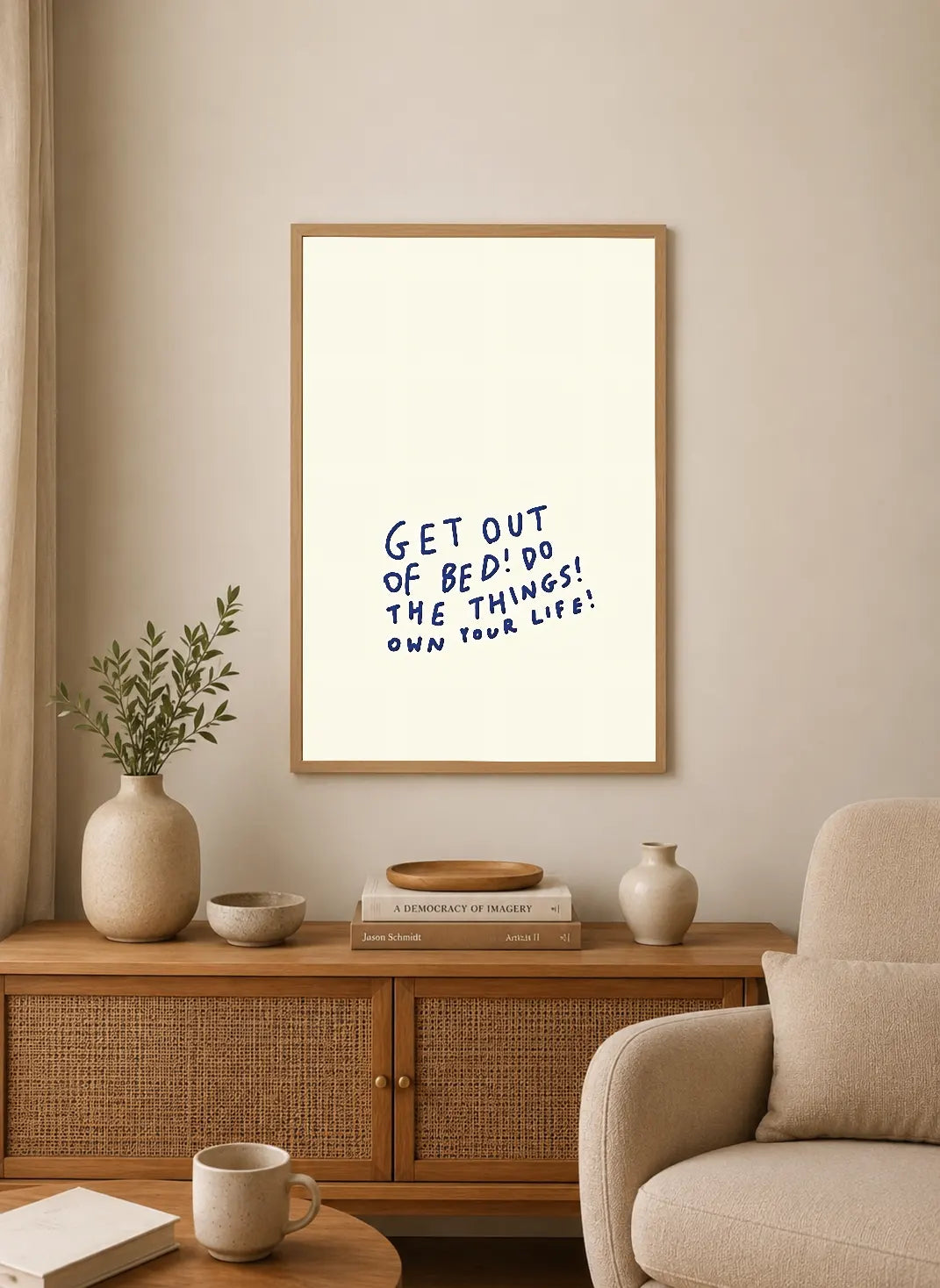 Portrait poster with handwritten blue text on cream background: "GET OUT OF BED! DO THE THINGS! OWN YOUR LIFE!"