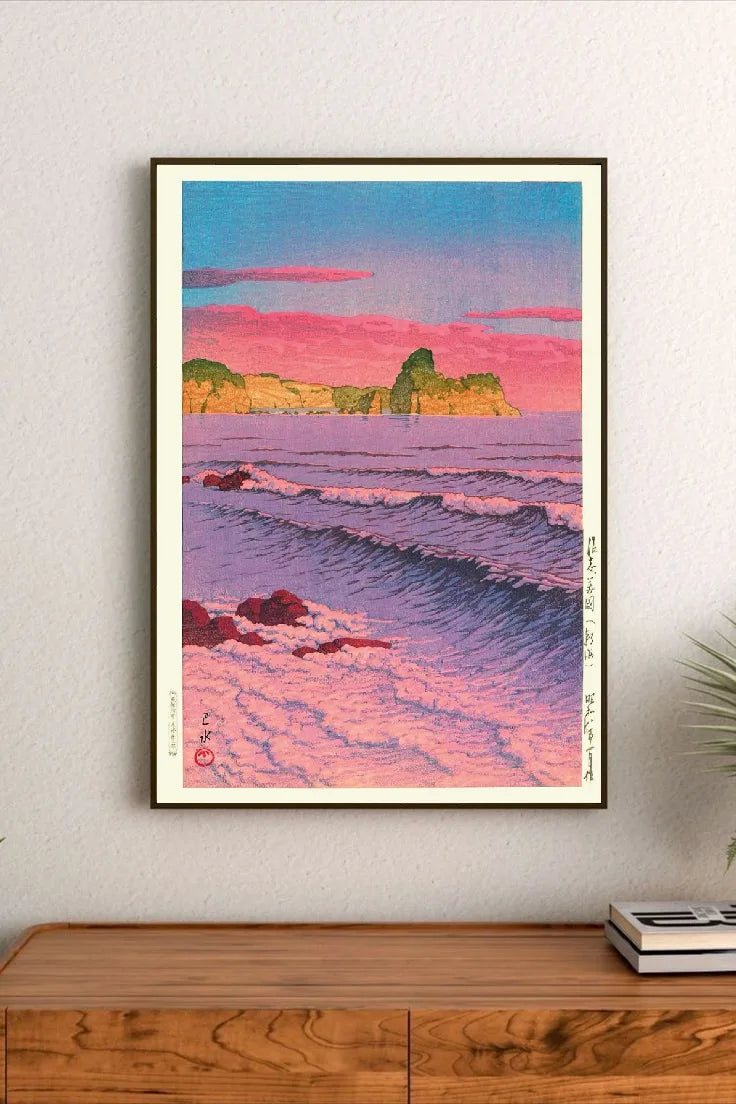 Portrait print depicts ocean waves in purples and pinks under a sky with pink clouds, distant green cliffs, and Japanese calligraphy on sides