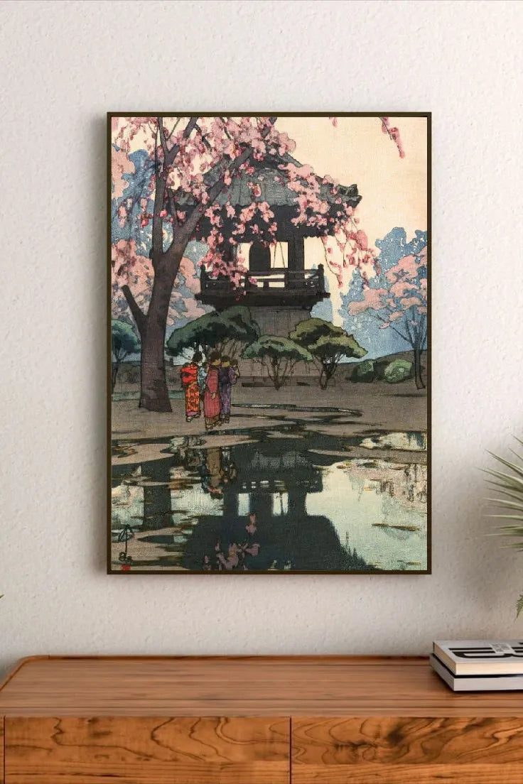Portrait print featuring three figures in traditional attire walking beneath a blossoming cherry tree near a pavilion reflected in water