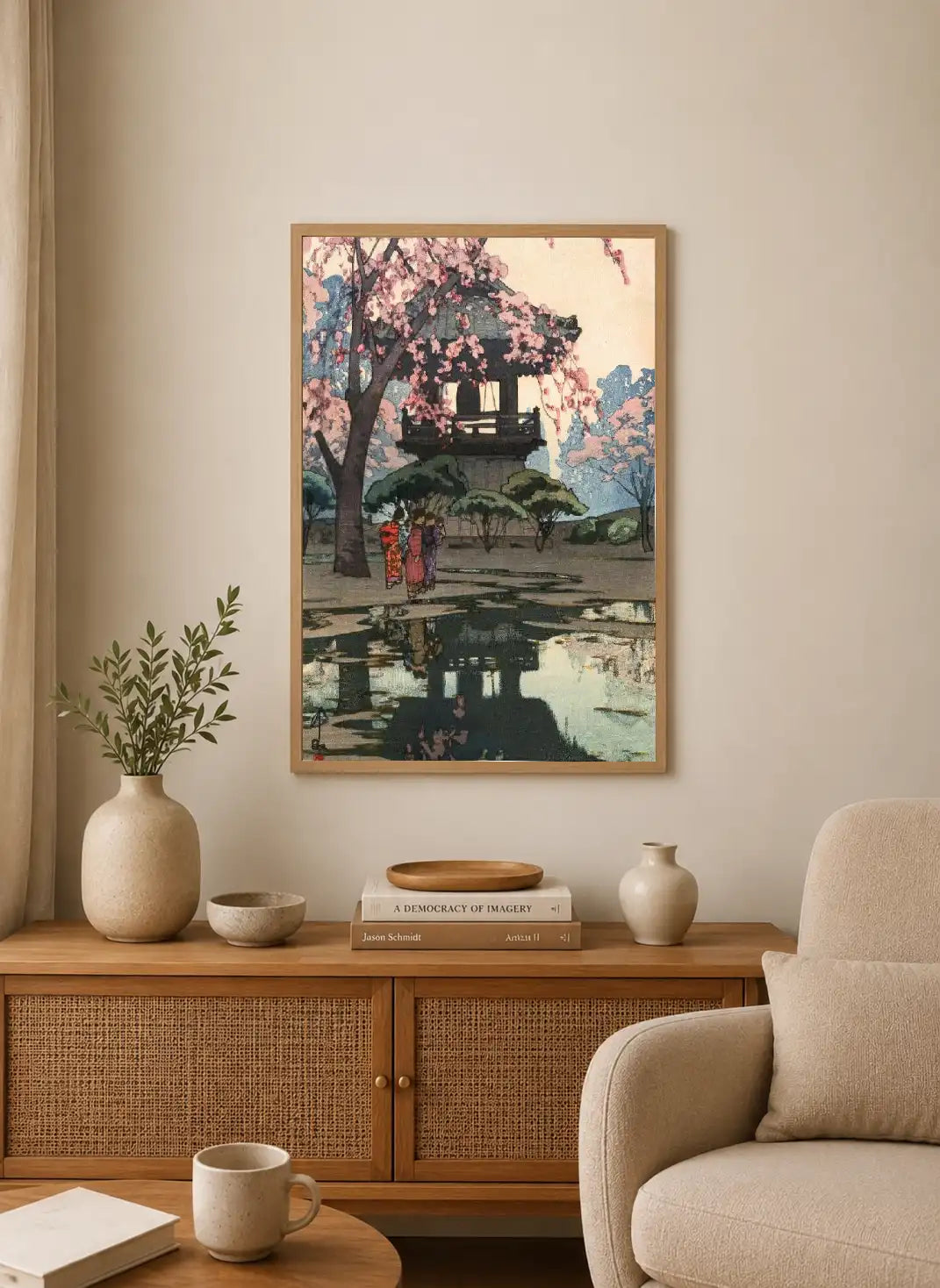 Portrait print depicting a Japanese torii under cherry blossoms with two figures walking past, rendered in soft pink, blue, and green tones