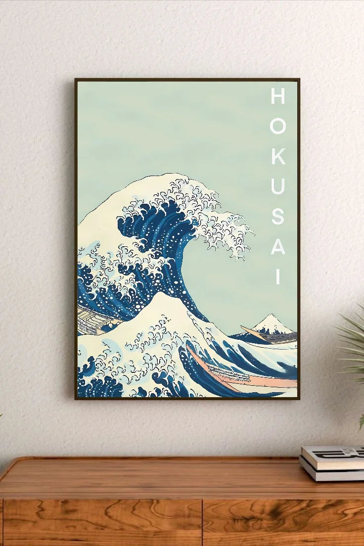 Portrait poster featuring a stylized wave with deep blues and cream highlights, vertical "HOKUSAI" text in white, traditional Japanese wave motif