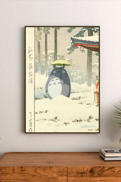Portrait poster featuring Totoro holding a yellow umbrella in a snowy forest with traditional Japanese architecture and vertical calligraphy on the