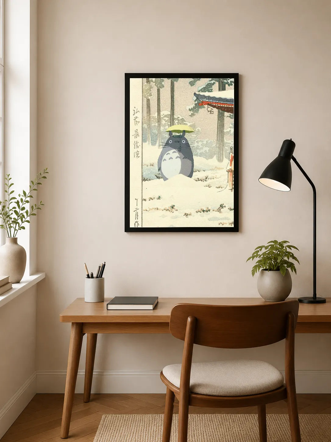 Portrait print depicts Totoro under yellow umbrella in snowy forest with Japanese characters on left side