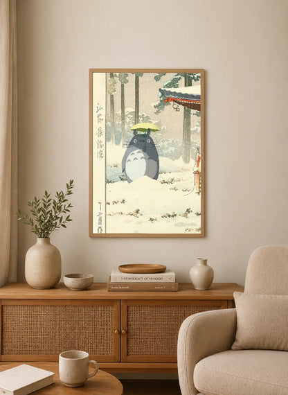 Portrait print depicts Totoro in snowy forest holding green umbrella, with Japanese calligraphy on left side