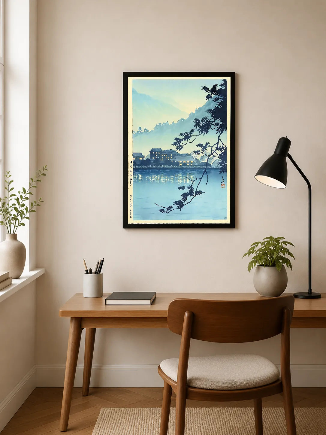 Blue-toned landscape with silhouetted maple branches framing distant Japanese buildings reflected in calm water