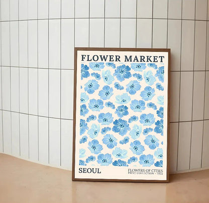 Vertical print in soft blues and vibrant pinks, displaying a detailed composition of stylized flowers and celebratory lettering