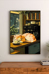 Portrait poster depicts an orange tabby cat sleeping on a counter beside coffee cups and a espresso machine, rendered in warm, soft tones