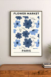 Watercolor floral art in deep midnight blues and purples, depicting stylized blooming botanicals with subtle Parisian script typography