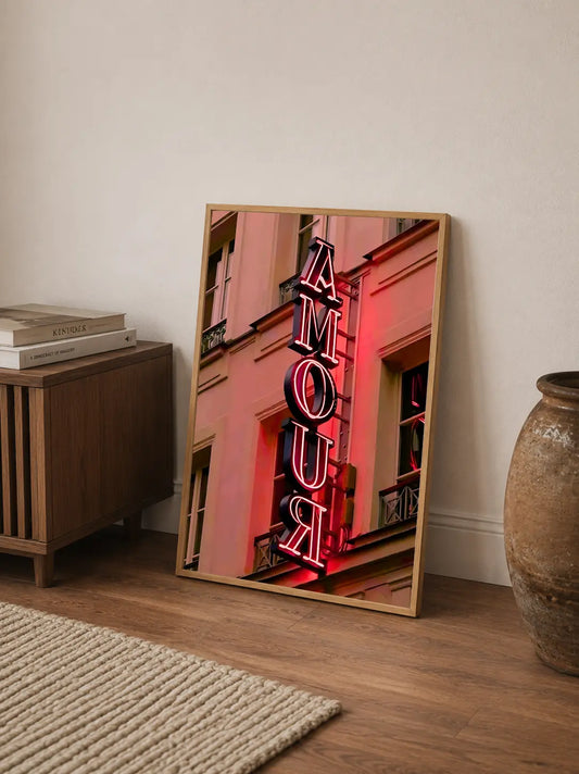 A typographic poster featuring abstract faces and flowing lines in black, white, and vibrant pink hues, arranged vertically on a portrait canvas