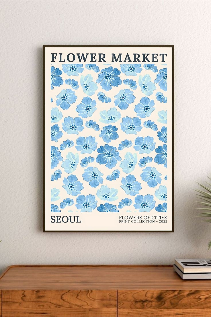 Portrait poster featuring blue petals and pink lemonade themes with stylized typography and delicate pastel floral illustrations