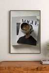 Portrait poster featuring a person holding a mug of iced coffee over a Vogue Italia magazine cover with bold typography and minimalist design