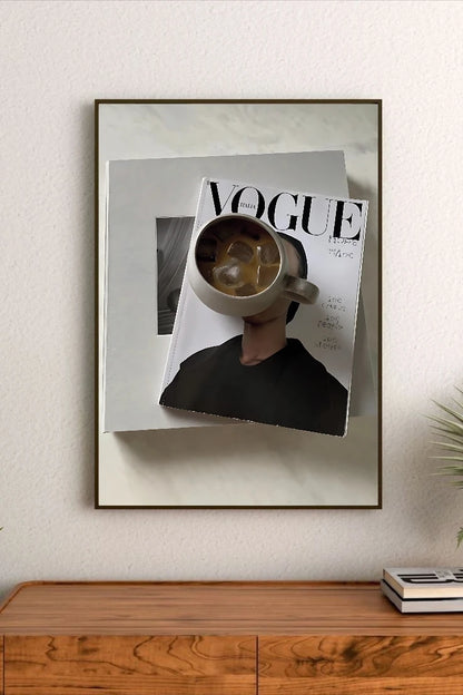 Portrait poster featuring a person holding a mug of iced coffee over a Vogue Italia magazine cover with bold typography and minimalist design