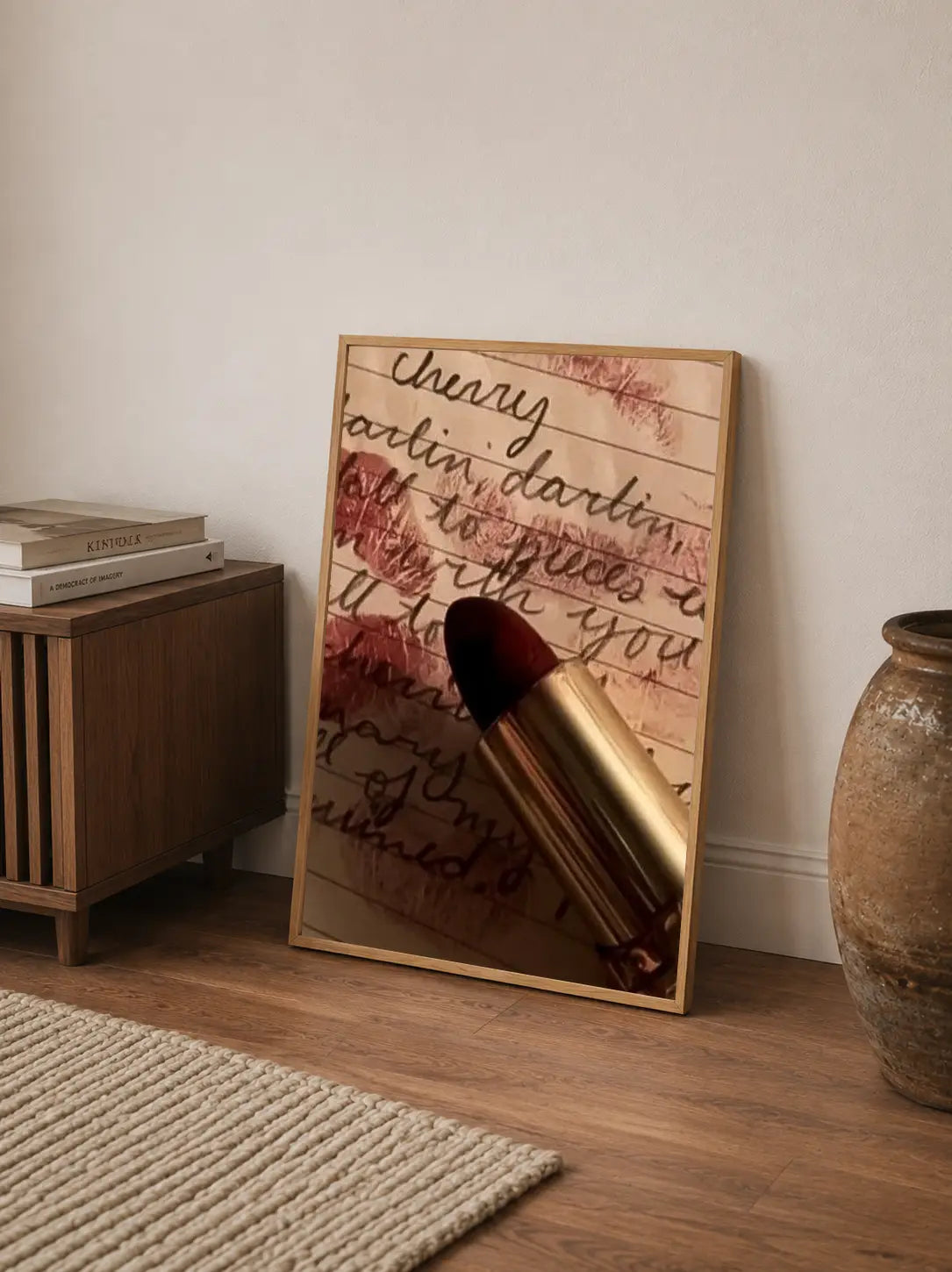 Abstract graphic art featuring distressed typography and shadowy figures in deep black, crimson, and aged parchment tones