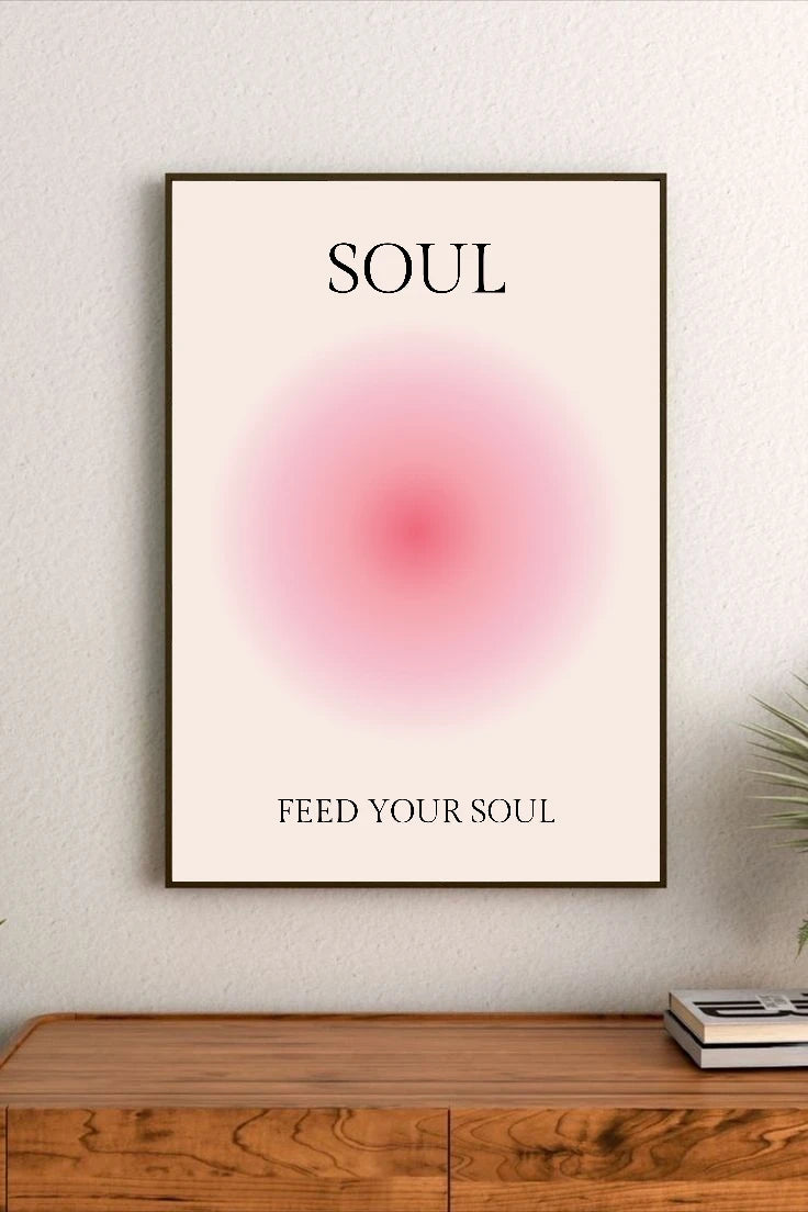 Portrait poster with black serif typography reading "SOUL" and "FEED YOUR SOUL," centered above a soft pink radial gradient on cream background