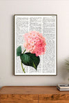 Botanical collage featuring delicate pressed petals and leaves in soft pastel pinks and sage greens, arranged in a vertical cluster design