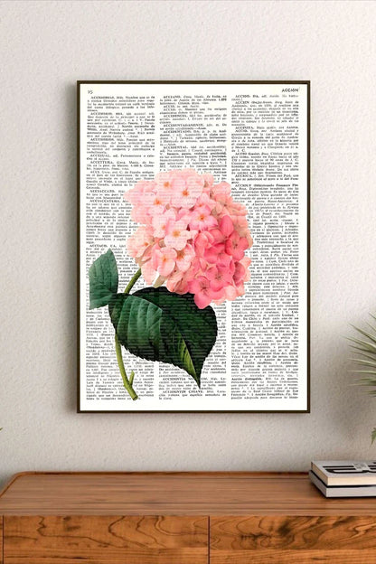 Botanical collage featuring delicate pressed petals and leaves in soft pastel pinks and sage greens, arranged in a vertical cluster design