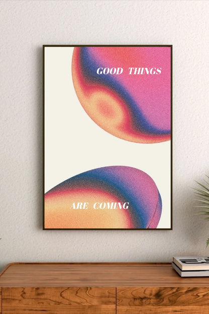 Portrait poster with abstract gradient circles in pink, purple, and orange; white sans-serif text reading "GOOD THINGS ARE COMING"