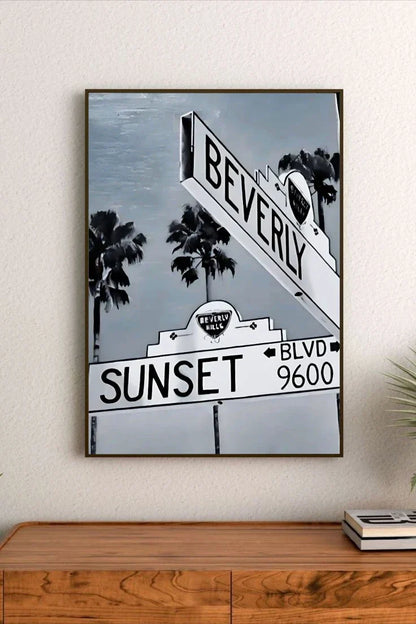Retro poster artwork featuring a vibrant sunset gradient of orange and pink over urban elements and stylized typography