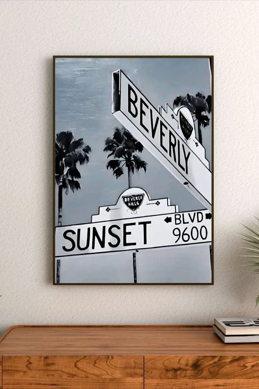 Retro poster artwork featuring a vibrant sunset gradient of orange and pink over urban elements and stylized typography
