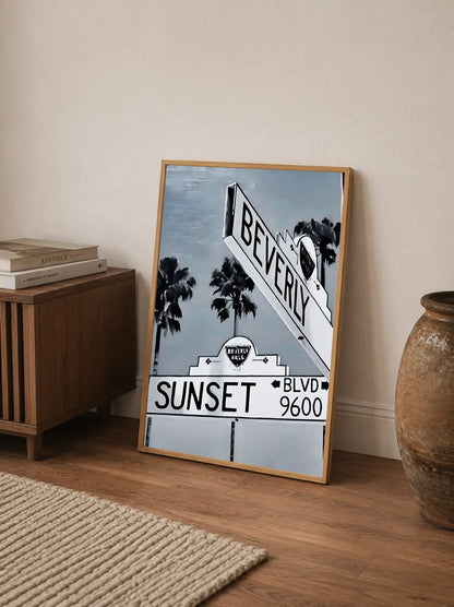 Stylized vintage print showing city skyline silhouettes against dramatic tropical sunset hues with embedded text details