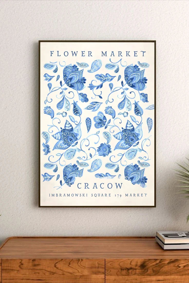 Botanical illustration of clustered flowers and leaves in soft blues, creams, and muted purples, arranged vertically in a detailed bouquet composition