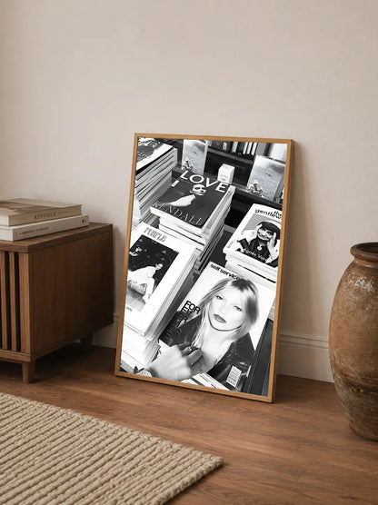A mixed media collage featuring sepia-toned photographs, overlapping fashion magazines, and bold black typography on an off-white background